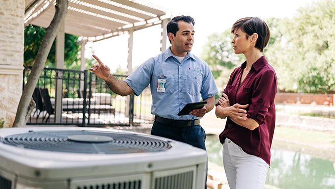 Technician explaining to customer.