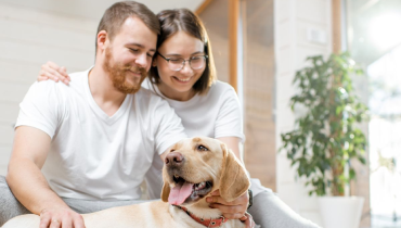 A happy couple with their pet.