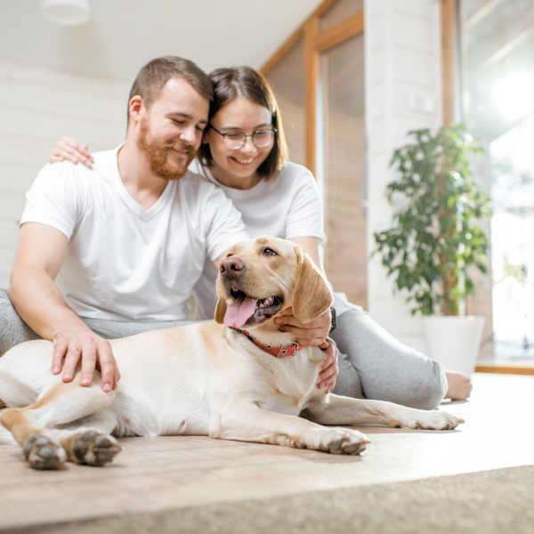 A happy couple with their pet.