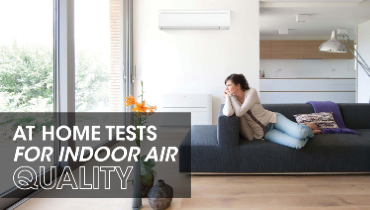 Woman on couch gazing out window with text: 