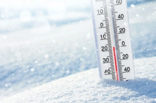 Wintertime winter background thermometer snow on.