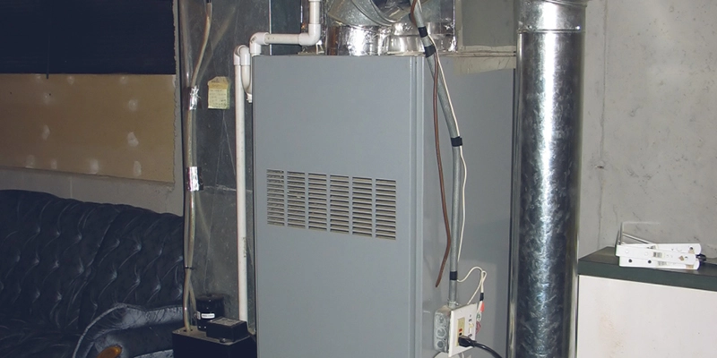 Old furnace next to sofa